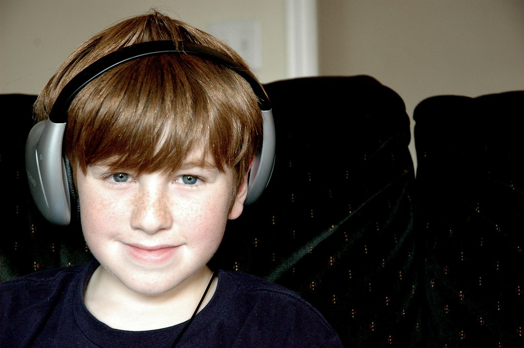 Headphones make his listening experience more interesting