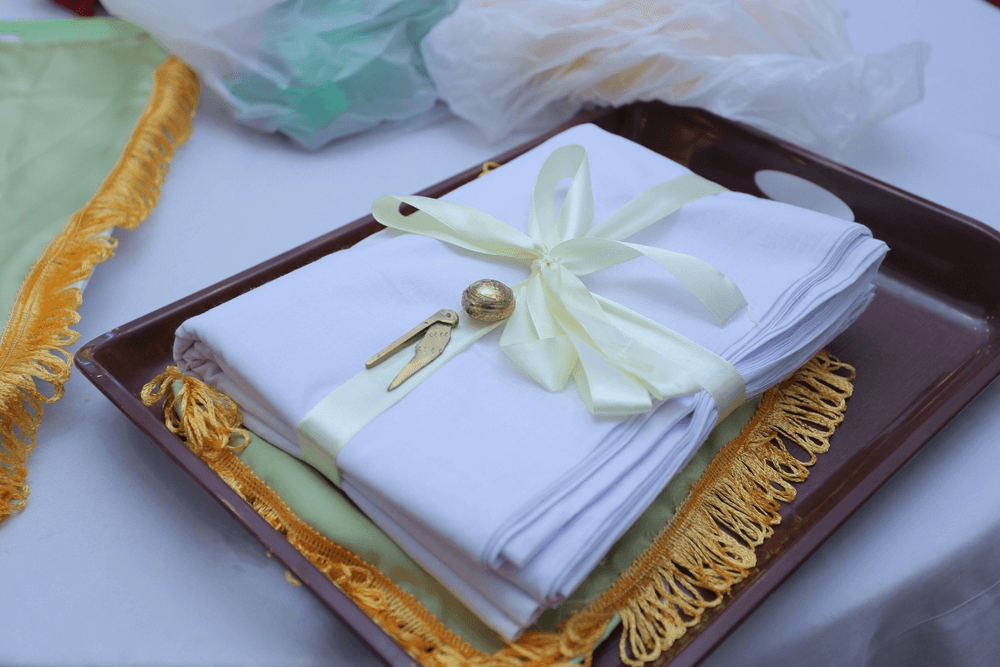 A Clothing gift is given to the bride’s mother