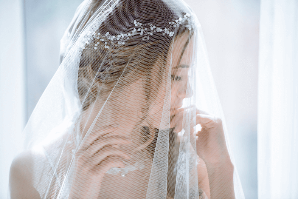 Wearing bridal veil